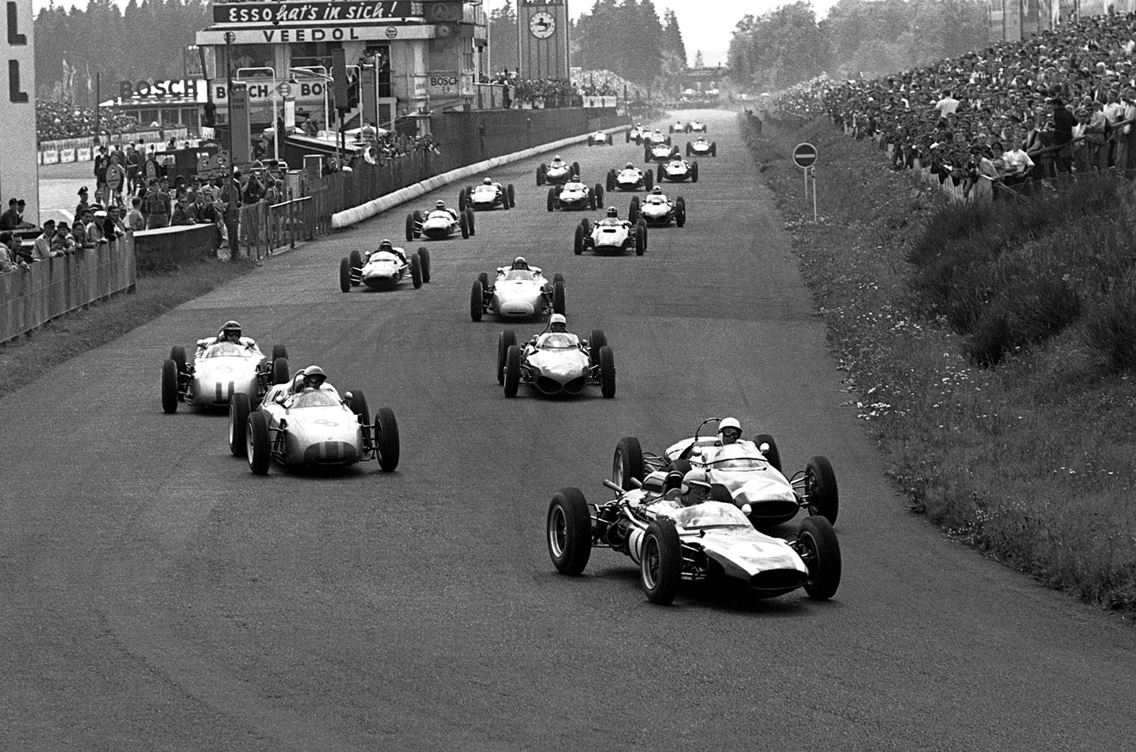 Brabham (Cooper T58) led off the line at the Nürburgring, Moss (Lotus 18/21) in hot pursuit