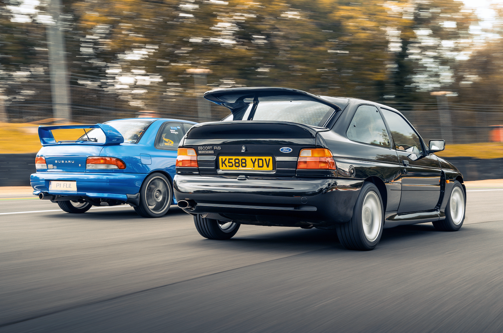 Classic & Sports Car - Black & Blue: Ford Escort RS Cosworth vs Subaru Impreza P1