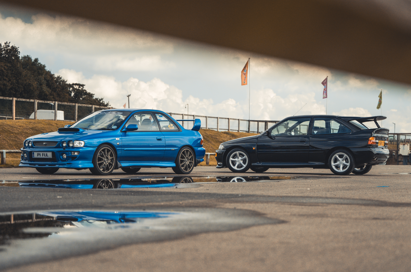 Classic & Sports Car - Black & Blue: Ford Escort RS Cosworth vs Subaru Impreza P1